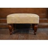 A 19th century style foot stool in floral upholstery on mahogany carved baluster supports. H.35 W.53