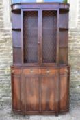 A Georgian style bow fronted mahogany two section library bookcase. H.183 W.105 D.27cm