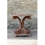 A Continental olive wood occasional table with plate glass top on figural carved surface raised on