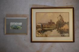 A large framed and glazed watercolour, riverscape with cathedral in the distance along with a