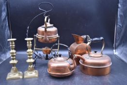 A collection of 19th century copper and brass items. To include three copper kettles with wrougt
