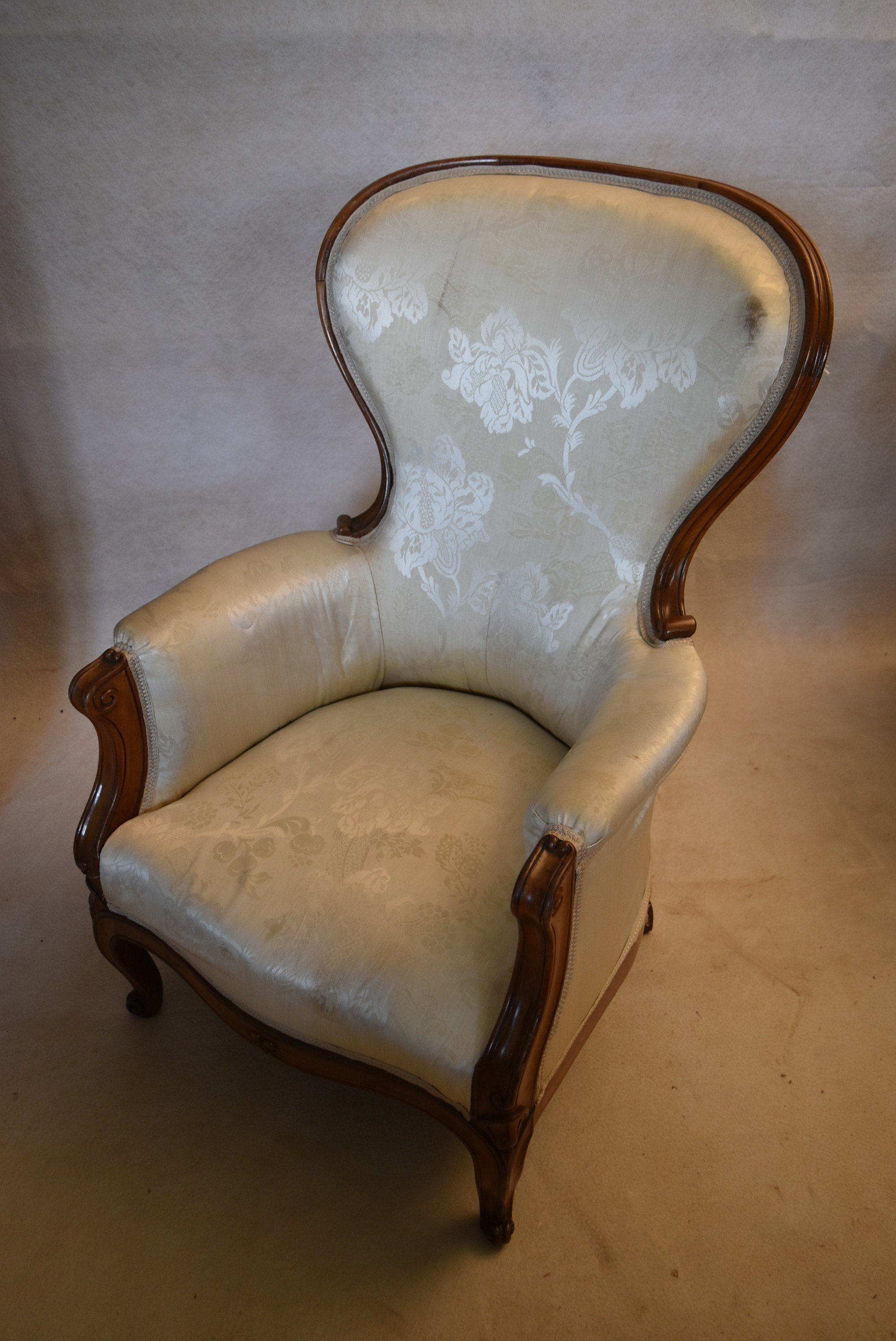A 19th century carved walnut armchair in floral damask upholstery on cabriole supports. H.102 W.65 - Image 4 of 4