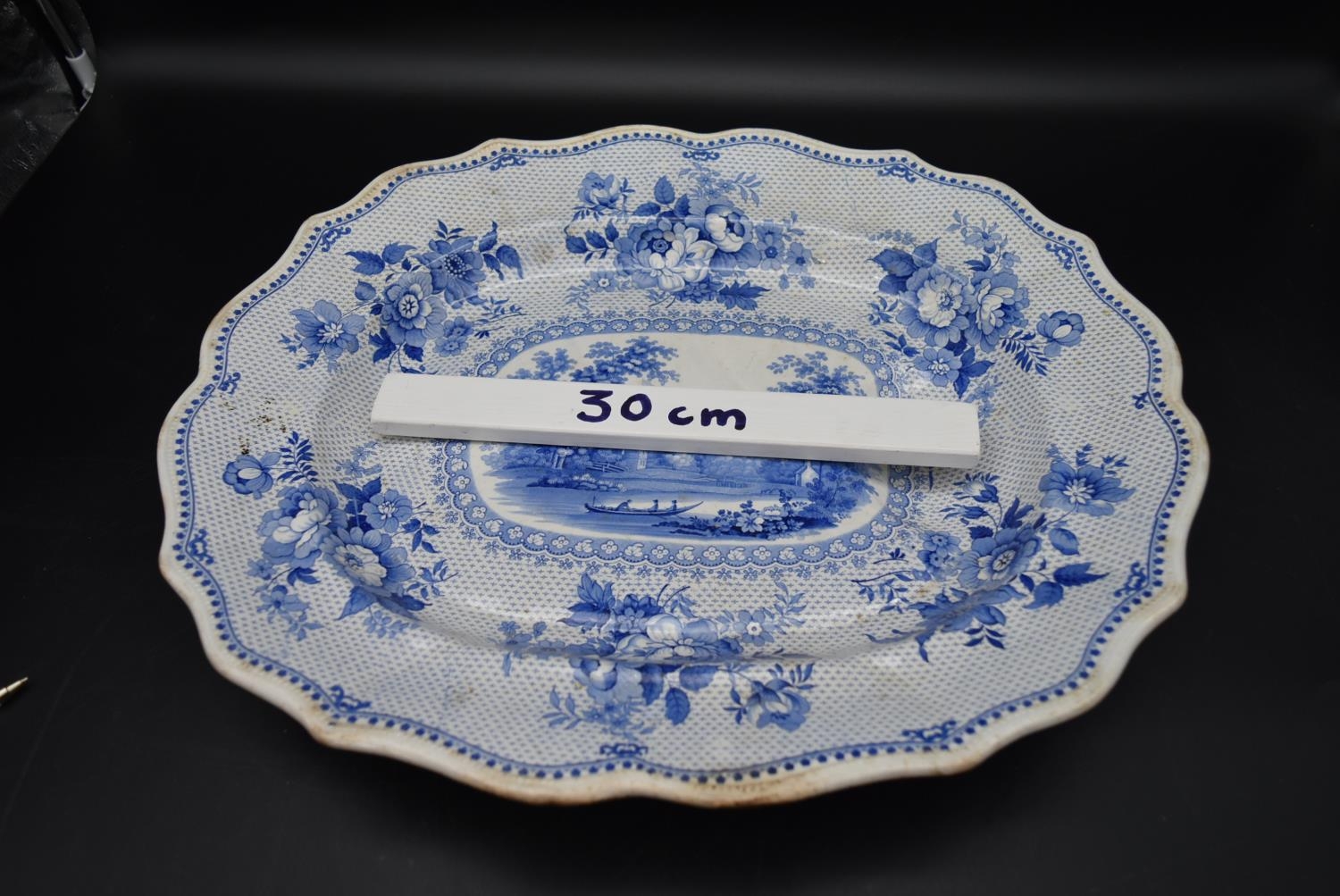 An early 20th century blue and white serving platter, with painted lake scene and floral designs, - Image 5 of 5