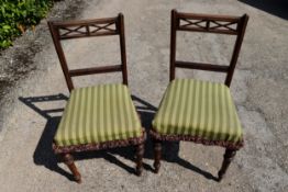 A pair of late 19th century mahogany bedroom chairs on turned tapering supports. H.82 W.43 D.39cm