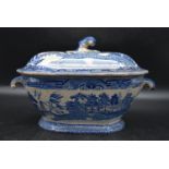 A 19th century blue and white tureen with scrolling drop handles either side and lid, decorated in