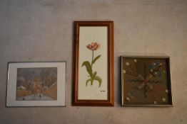 A mixed lot of three framed pictures. To include an embroidery depicting a flower, a print of a snow