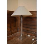A 20th century silver plated Corinthian column style table lamp with sage green shade. H.69 W.