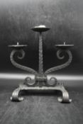 A 20th century three branch iron candelabra, stylised with twist branches and swirl design. H.33 W.