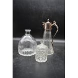 An late 19th century claret jug with silver plated lid and a cut crystal jar with lid along with a