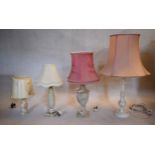 A miscellaneous collection of mid century table lamps with their shades to include marble and carved