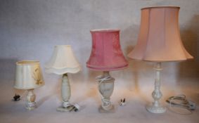 A miscellaneous collection of mid century table lamps with their shades to include marble and carved