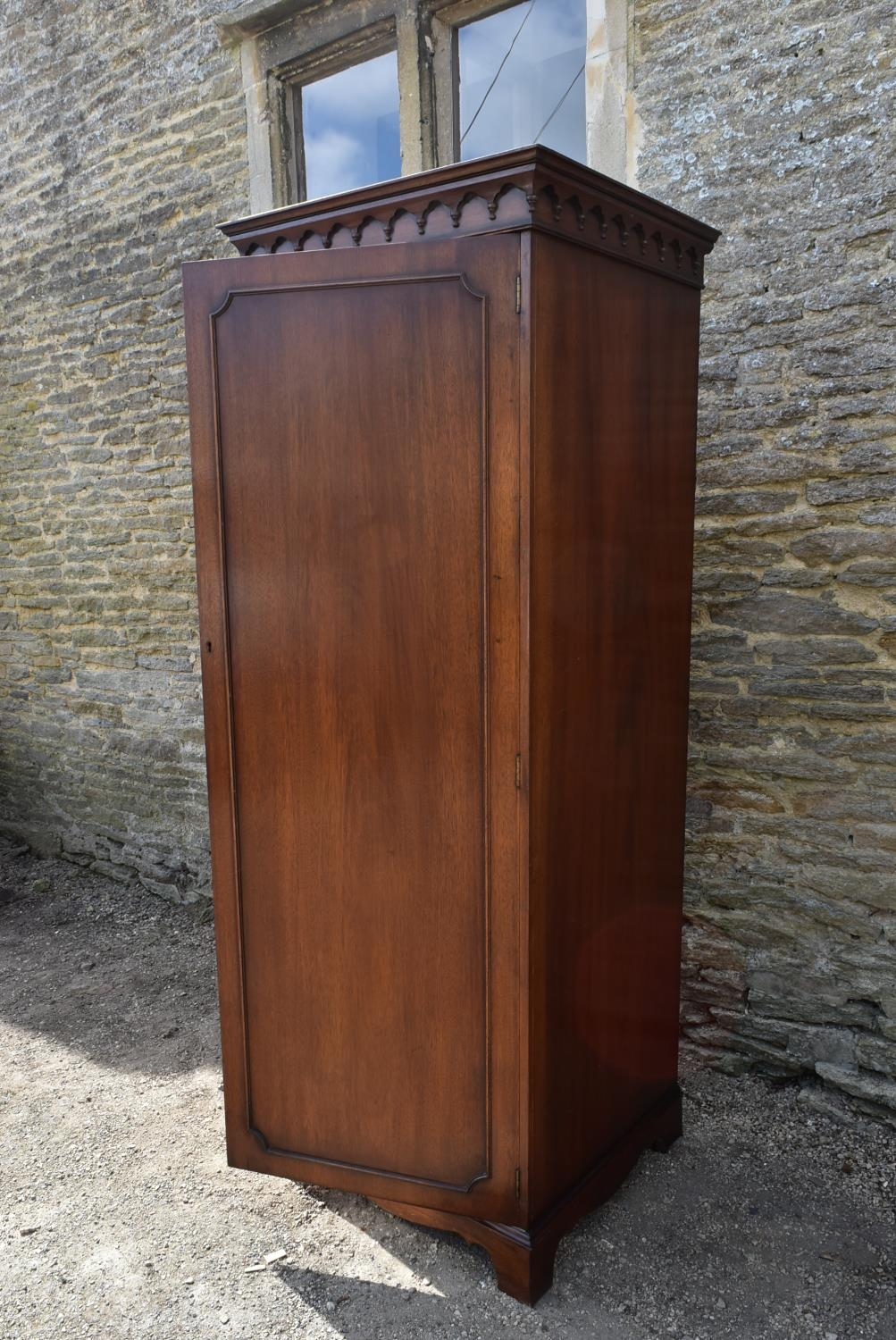 A Georgian style mahogany single wardrobe with panel door enclosing hanging section on shaped - Image 4 of 5
