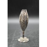 An early 20th century Chinese silver repousse design floral bud vase with flower shaped base.