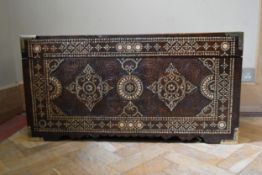 An Eastern carved hardwood hinged lidded coffer with all over bone inlaid decoration. H.45cm W.
