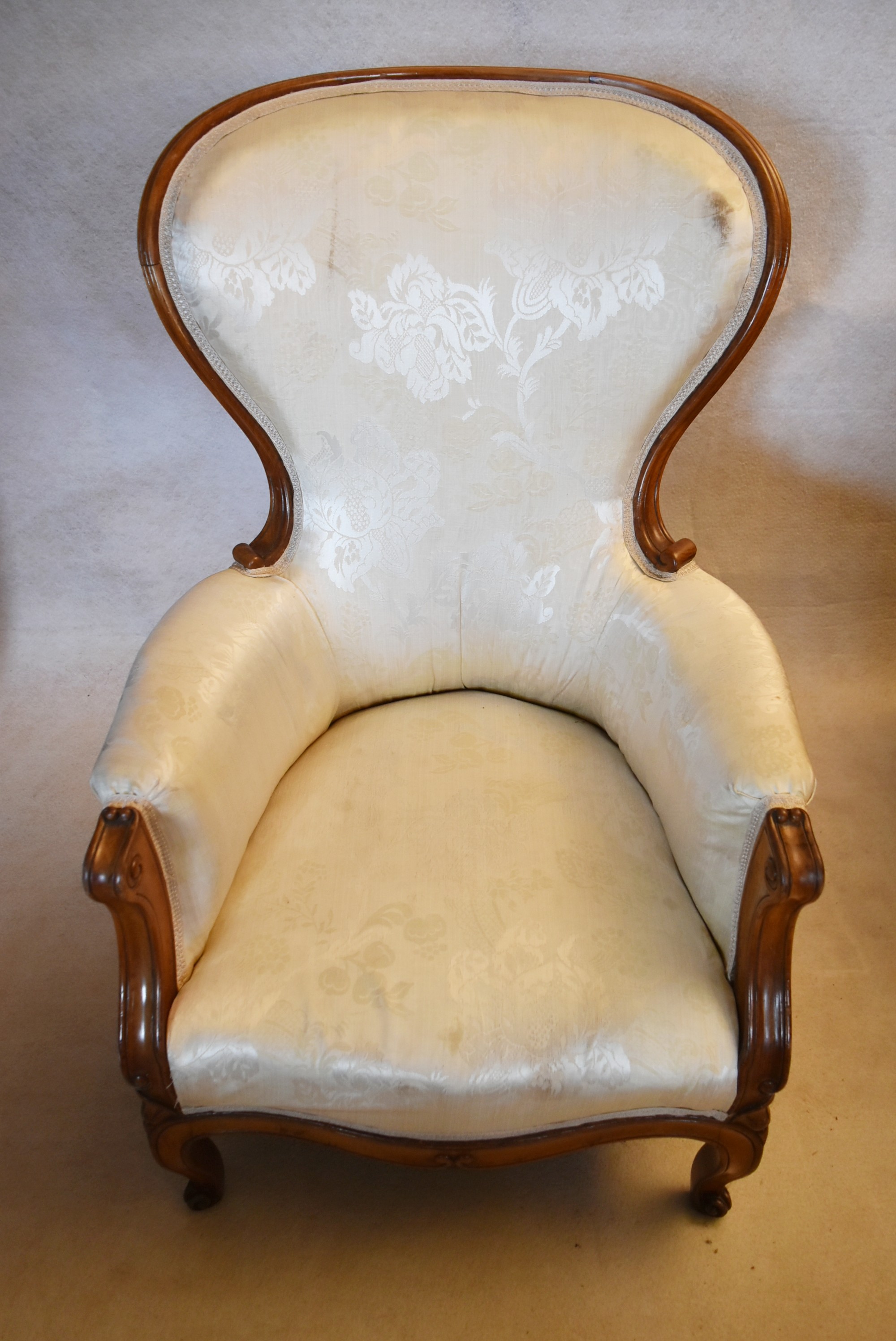 A 19th century carved walnut armchair in floral damask upholstery on cabriole supports. H.102 W.65 - Image 2 of 4
