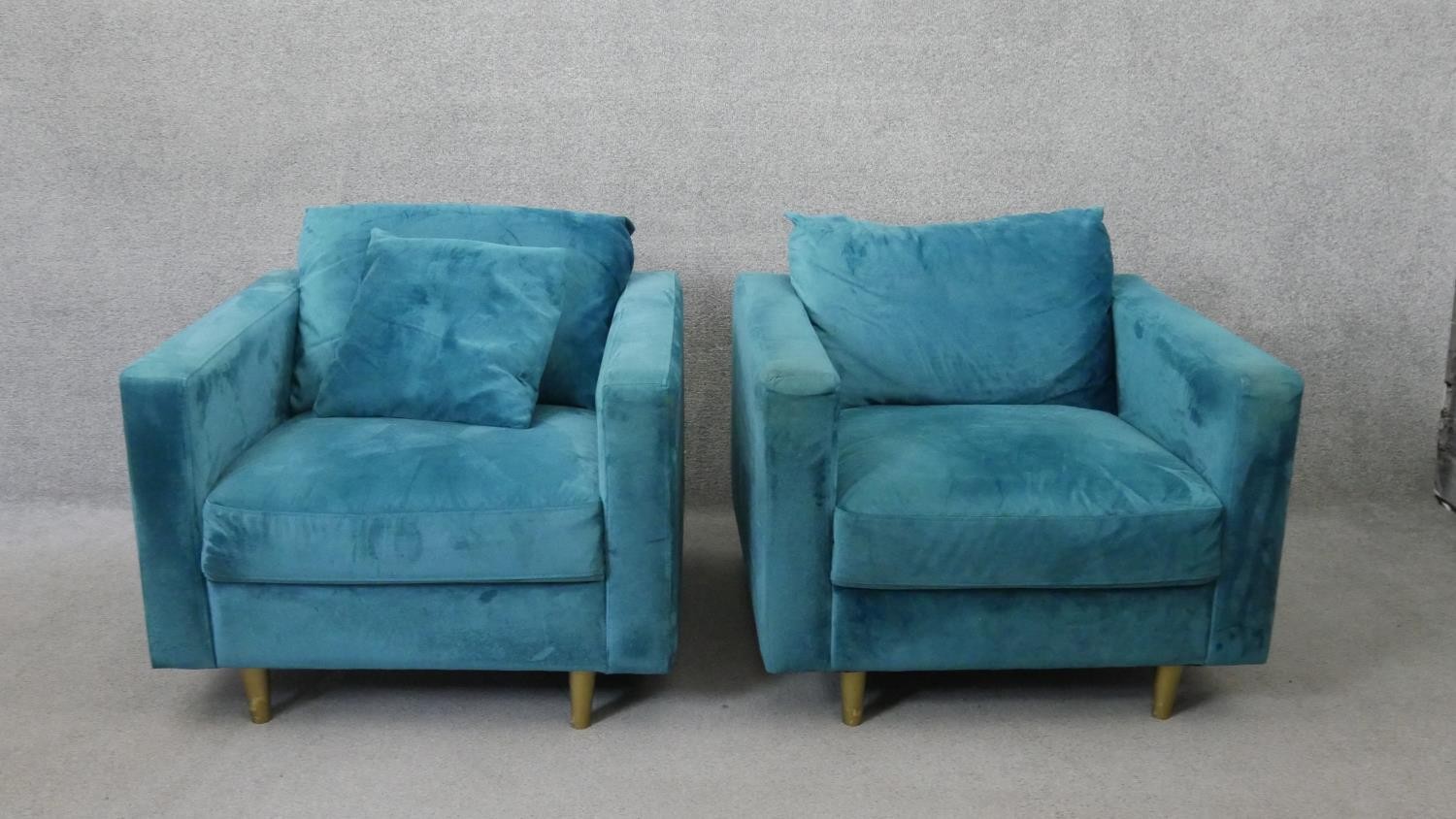 A pair of contemporary armchairs in faux suede upholstery. H.80 W.85 D.80 cm