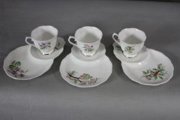 Three Royal Albert fine china hand painted cups and unusual saucers with integral plates each with a