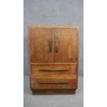 A mid century light oak Art Deco style tallboy cabinet. H.113 W.76 D.46cm