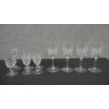 A collection of ten crystal glasses. Two sets of four cut crystal sherry glasses one set with