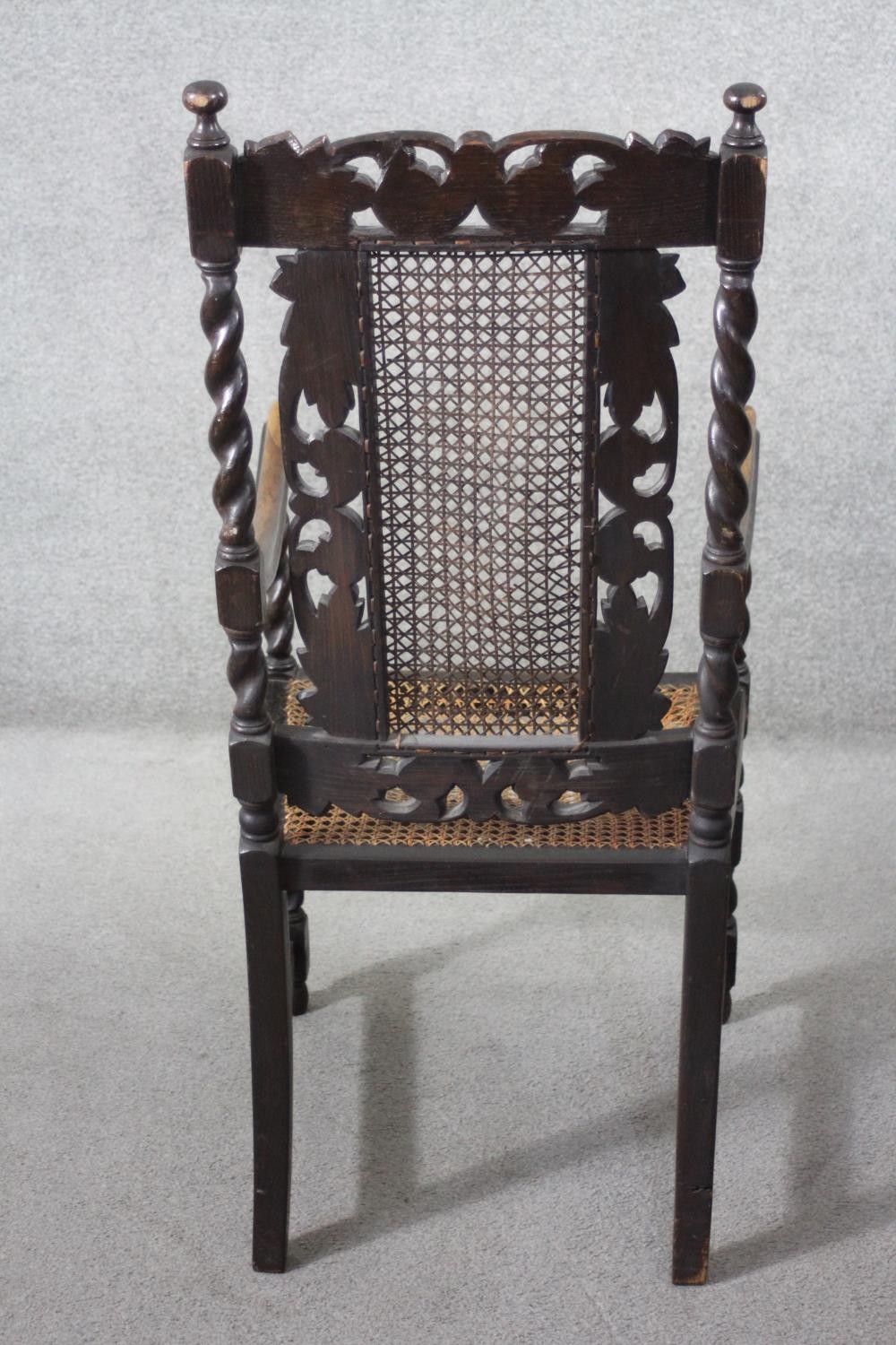 A late 19th century carved oak armchair with caned back and seat on stretchered barleytwist - Image 6 of 7