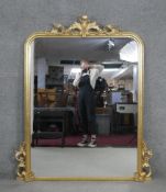 A 19th century style gilt framed overmantel mirror with moulded floral cresting and detail. H.152