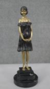 After Chiparus, 'Innocence', a patinated brass figure of a young female with floaty dress. H.33