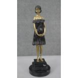 After Chiparus, 'Innocence', a patinated brass figure of a young female with floaty dress. H.33