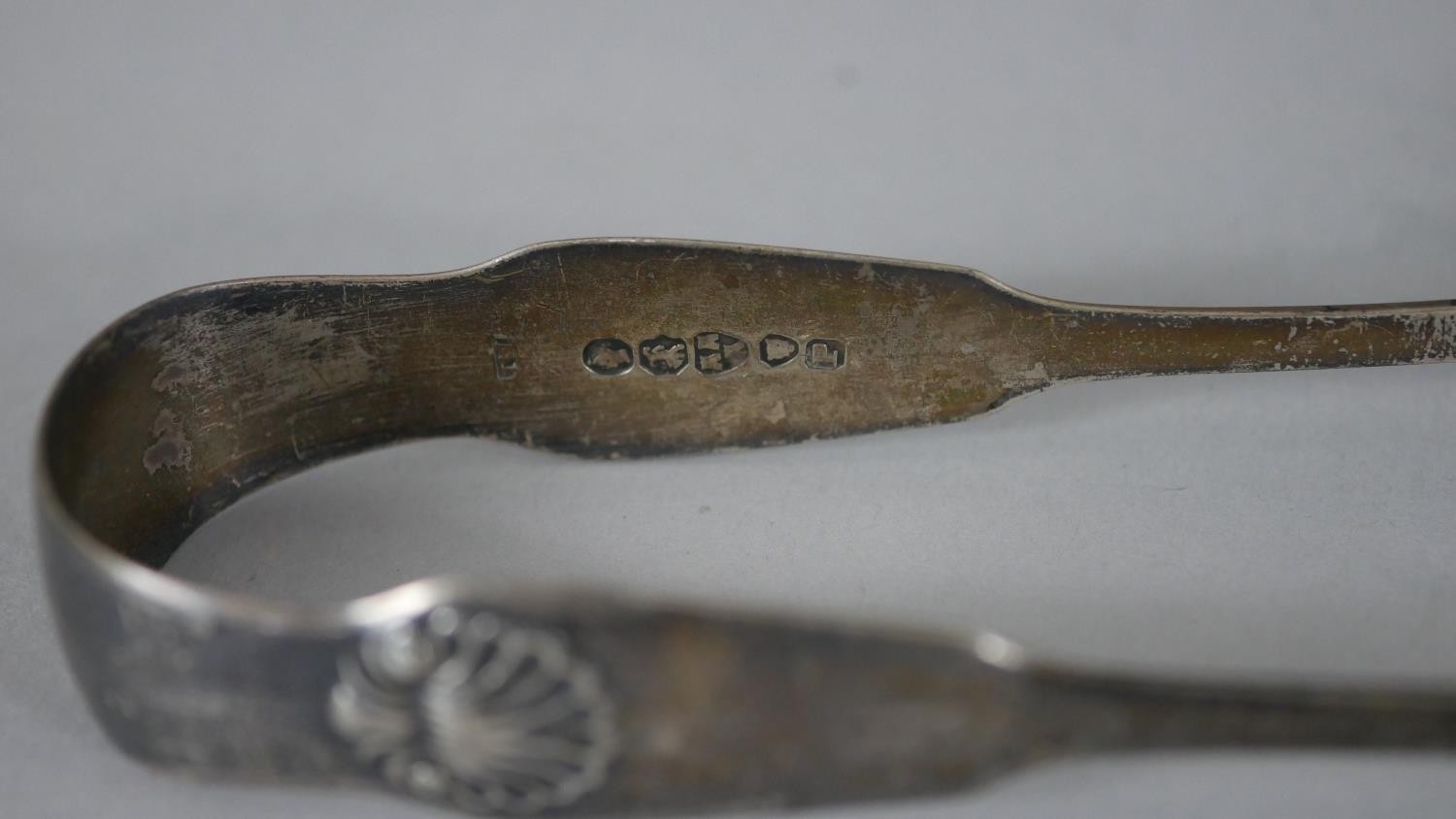 A collection of silver and silver plate. Including two sets of silver sugar tongs, one with shell - Image 4 of 10