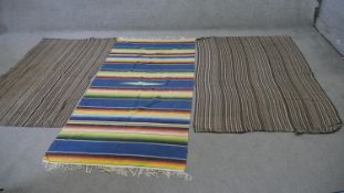 Two handmade Kelims with striped pattern along with a similar with a polychrome banded design. L.190