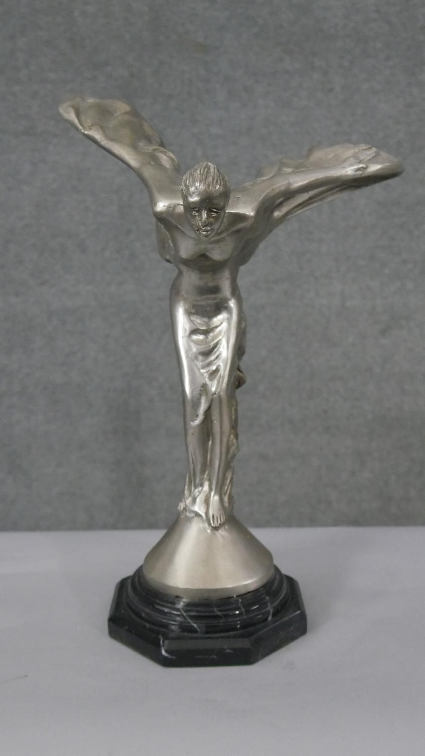 A large chromed model of the Spirit of Ecstasy, signed P. Psaier. H.40 W.29 D.26cm