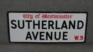 A vintage enamelled iron street sign for Sutherland Avenue, City of Westminster, with iconic and