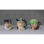 A collection of three Royal Doulton hand painted ceramic toby jugs. Including Beefeater, Sarah