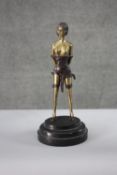 An Art Deco style patinated brass figure of 'The Whip Girl' after Bruno Zach. H.32 w.14 cm.