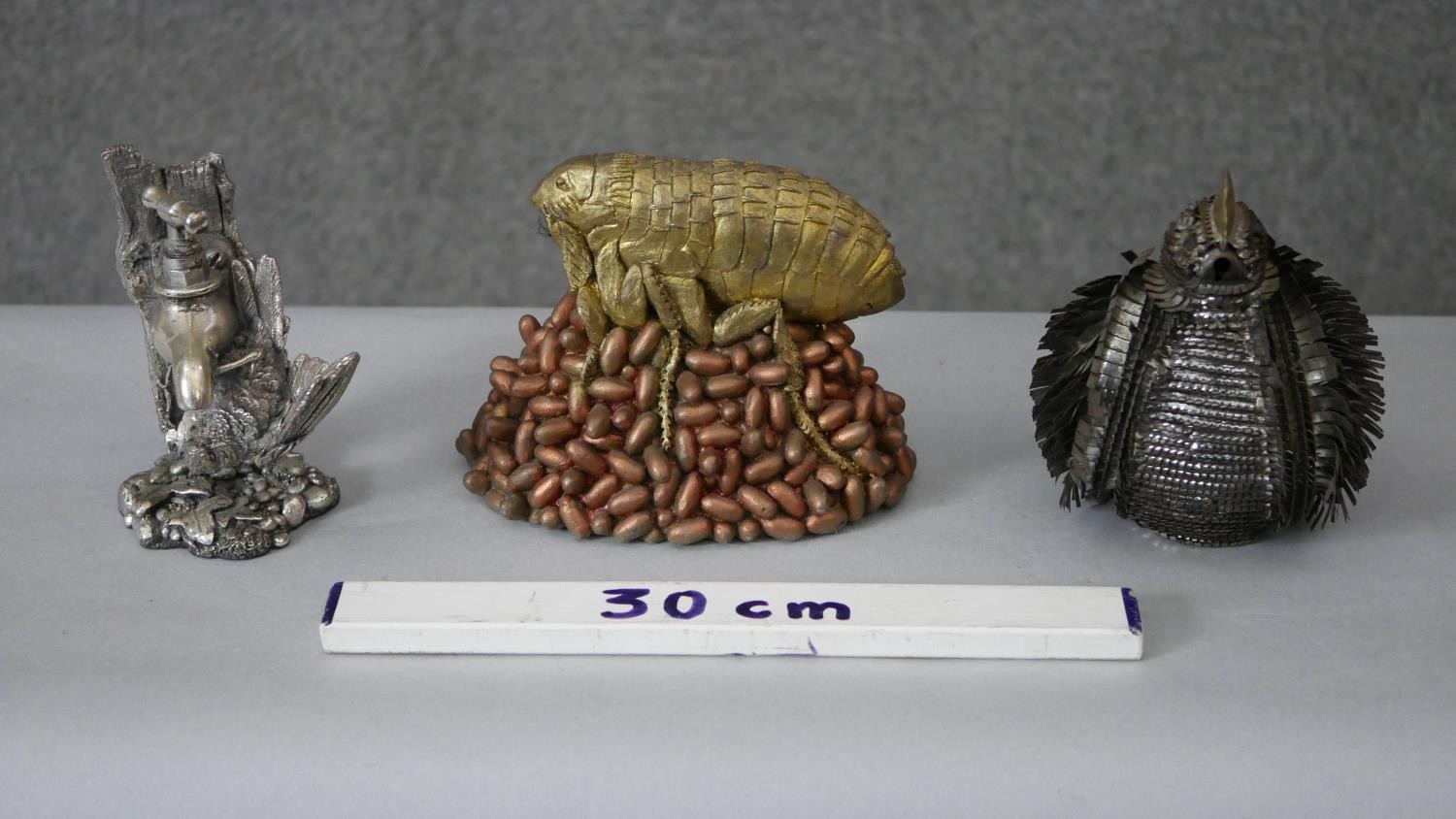 A gilded resin model of a flea on a pile of eggs along with a silvered covered model of a blue tit - Image 2 of 8