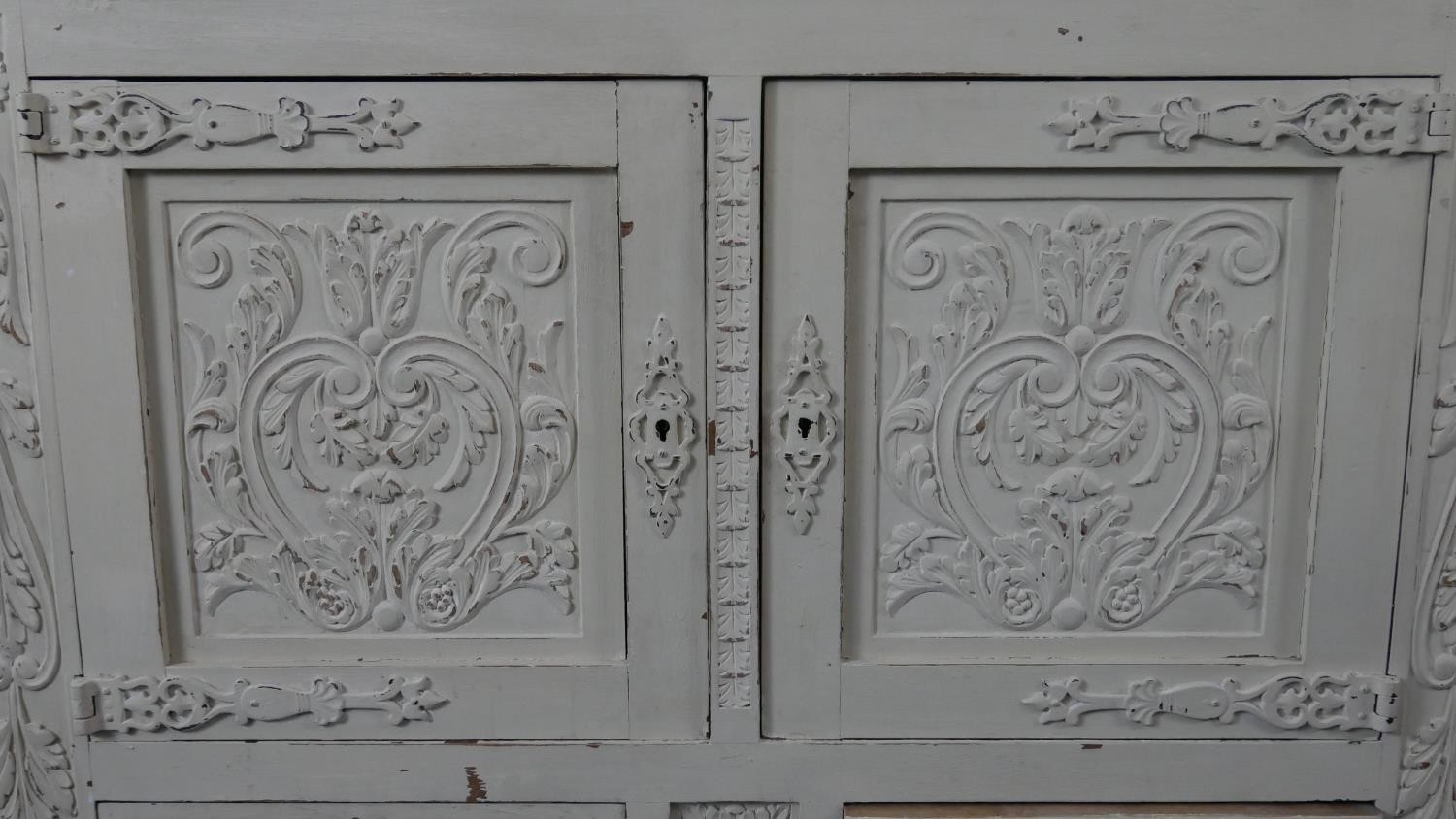 An early 20th century distressed painted 18th century style cabinet with all over carving on - Image 5 of 7