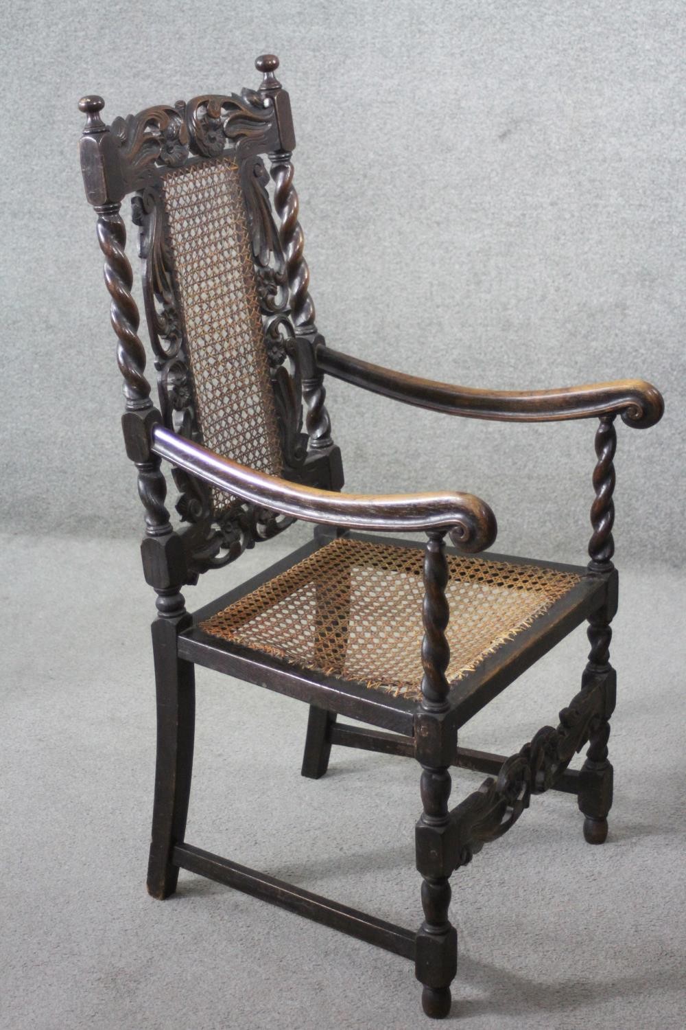 A late 19th century carved oak armchair with caned back and seat on stretchered barleytwist - Image 5 of 7