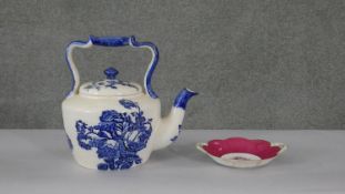 A blue and white Staffordshire ironstone tea pot, rose design along with a hand painted floral