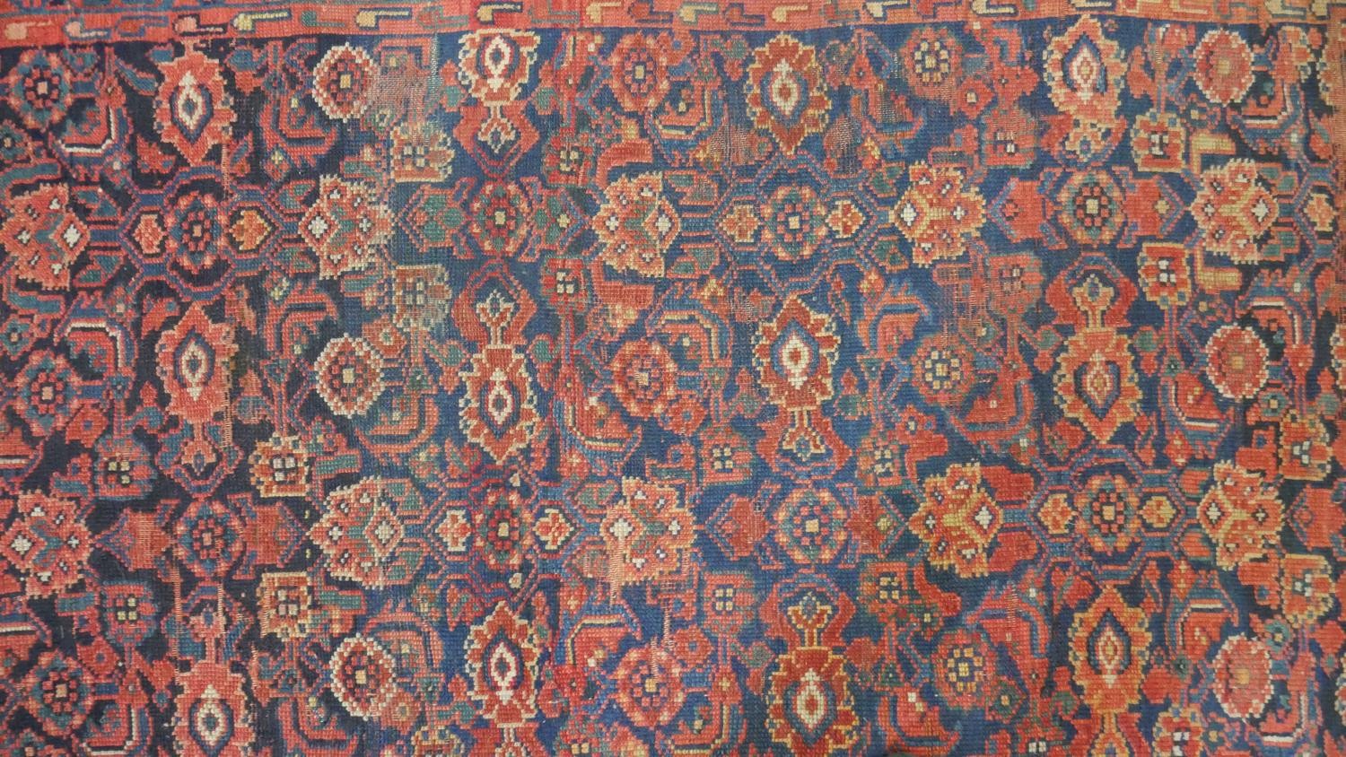 A Persian Mahal carpet with allover floral decoration on a midnight blue ground contained within - Image 3 of 5