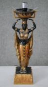 A gilded and painted resin lamp in the form of an Egyptian goddess. H.40 W.13cm