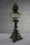 A Victorian cast pewter foliate design oil lamp with cut glass reservoir. Converted for electricity.