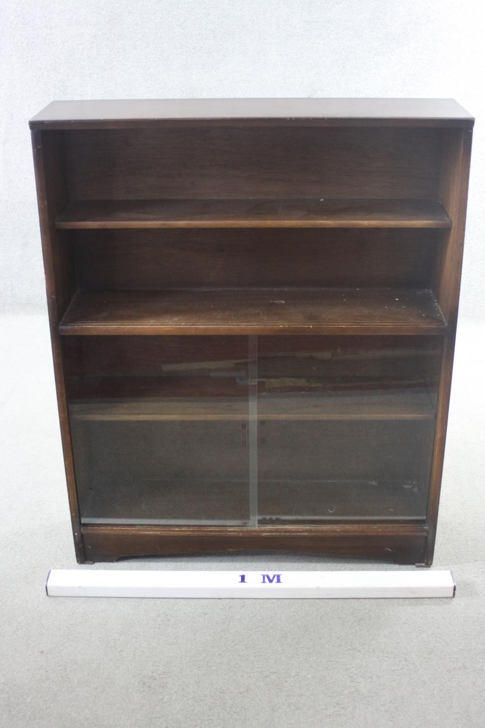 A vintage teak bookcase with open shelves above sliding plate glass doors. H.113 W.91 D.25 cm. - Image 5 of 5
