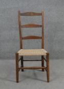 A 19th century Shaker style chair with woven seat.