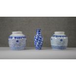 A collection of blue and white hand painted porcelain. A pair of Chinese blue and white lidded