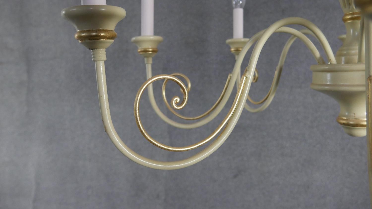 A large cream painted and gilded carved and metal scrolling design eight branch chandelier. H.50 W. - Image 4 of 4