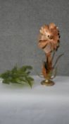 A sheet copper and brass embossed flower lamp along with a branch of green acrylic leaves on wire