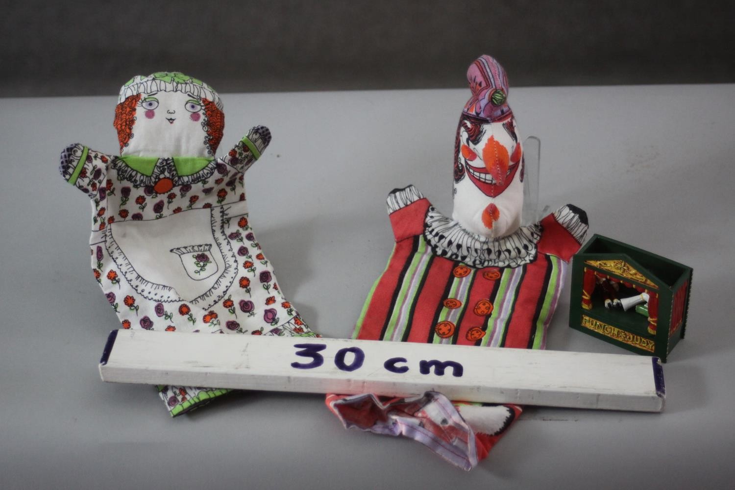 A miniature painted die cast Punch and Judy theatre with three articulated dolls along with two - Image 6 of 6