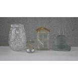 A collection of glassware. Including a cut crystal vase, a frosted glass cookie jar in the form of a