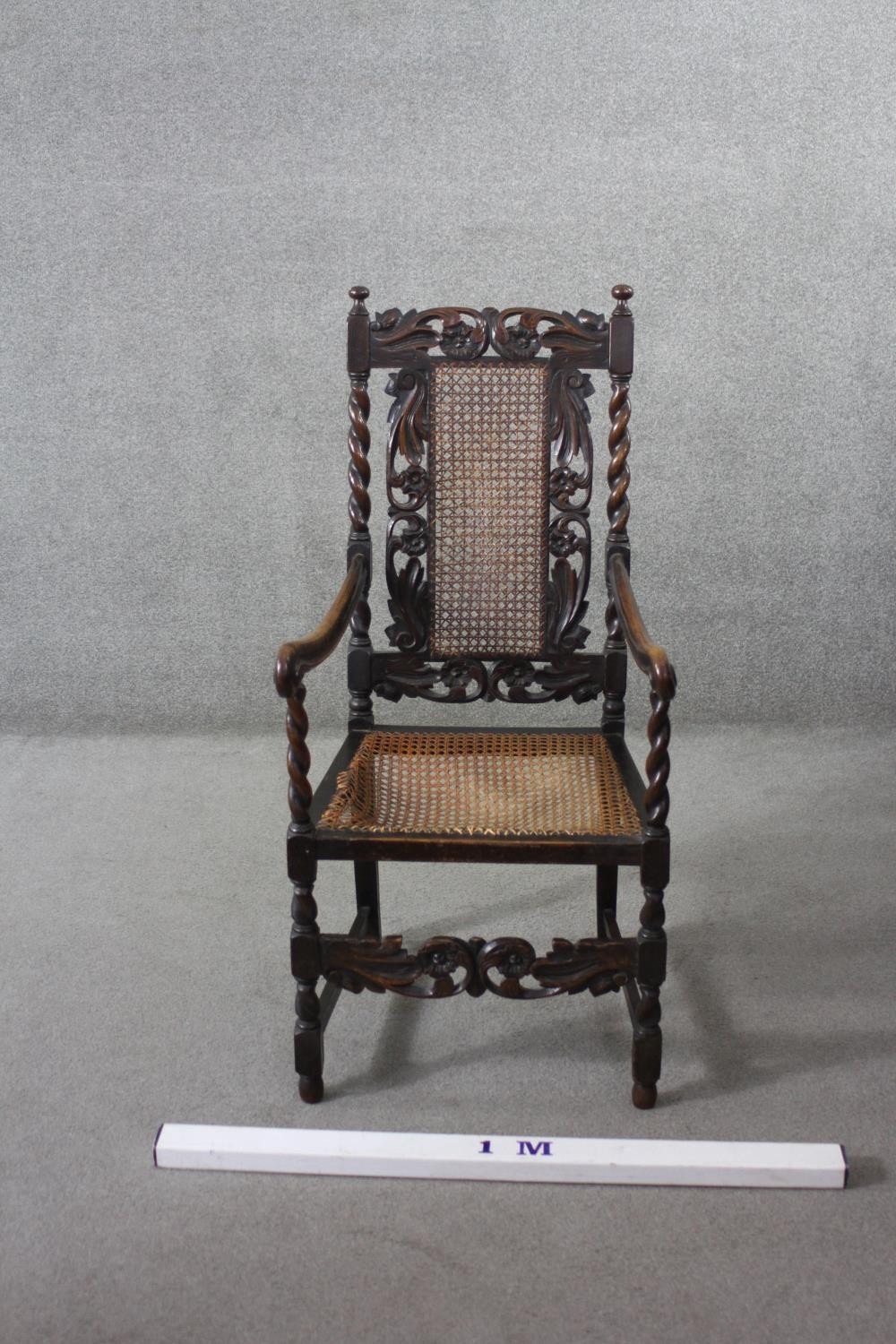 A late 19th century carved oak armchair with caned back and seat on stretchered barleytwist - Image 3 of 7
