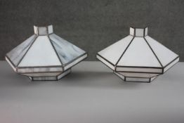 A pair of wall mounted lead and grey marbled stained glass lamp shades. H.20 W.34 D.15 cm.