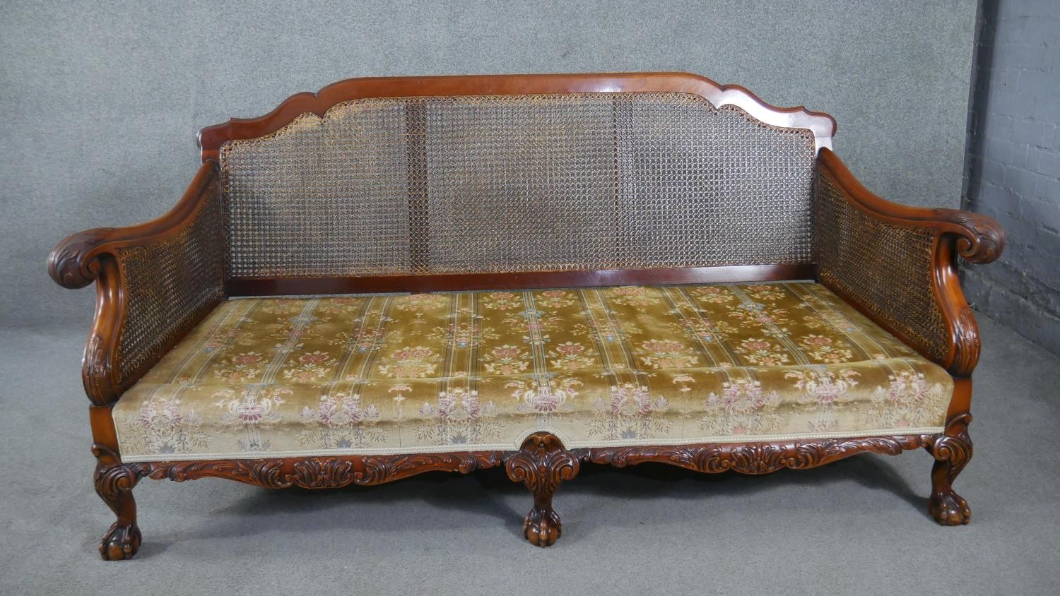 A mid century carved walnut three seater bergere sofa with double caned sides in cut floral - Image 6 of 7